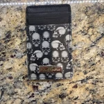 Robert Graham Magnetic Skulls Credit Card Wallet. Fixed Price $40.00.