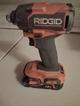 Used Ridgid 18V Brushless Cordless Impact Driver W/ Battery Orange/black. Fixed Price $45.00.
