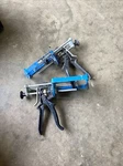 Two Used Cox 75-150 Dual Cartridge Manual Applicator Caulking Guns. Fixed Price $45.00.