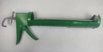 New Quart Size Articulo Caulking Gun 13" Model Number 56607. Fixed Price $8.89.
